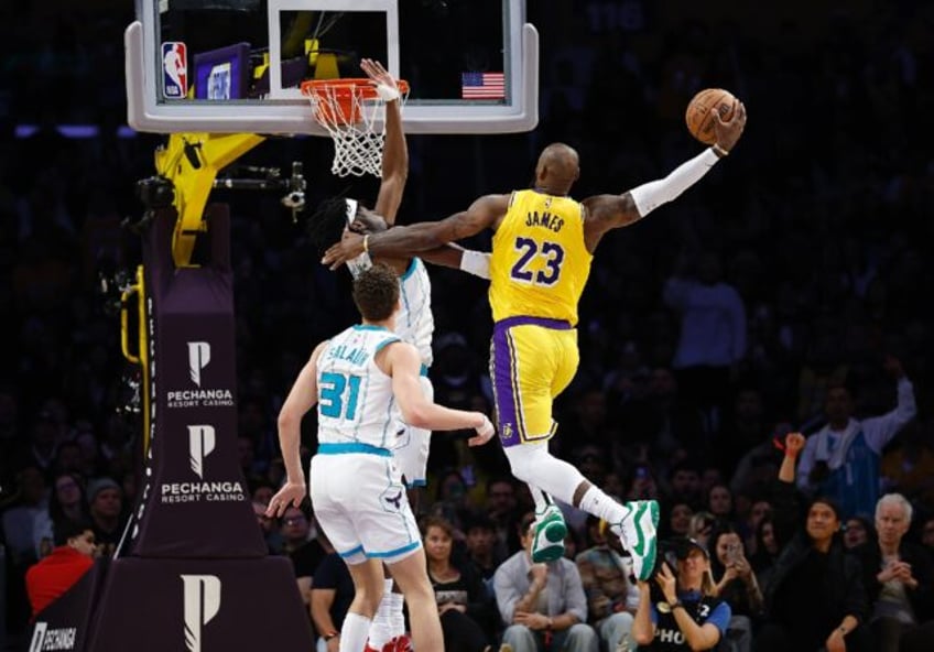 LeBron James drives to the basket in the Los Angeles Lakers defeat to the Charlotte Hornet