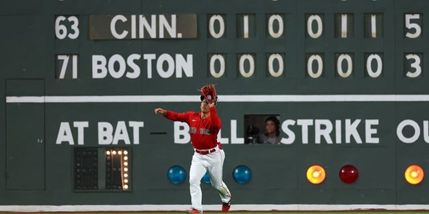 ball gets stuck in light of fenway parks green monster scoreboard