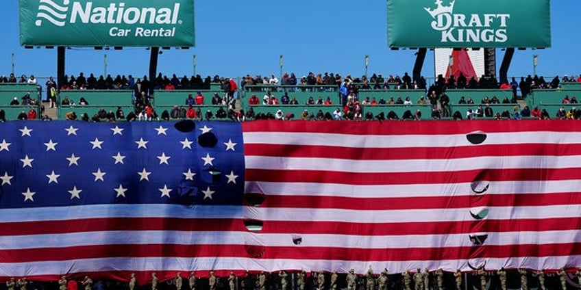 ball gets stuck in light of fenway parks green monster scoreboard