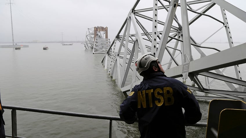 NTSB investigator looking at wreckage of Key Bridge