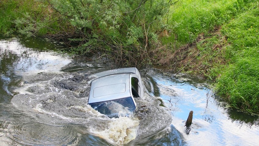 Sinking car in river