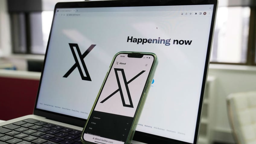 The opening page of X is displayed on a computer and phone