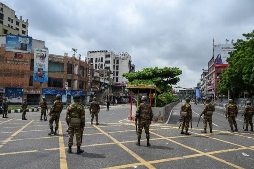 Bangladesh troops on patrol in the capital Dhaka after a curfew was announced