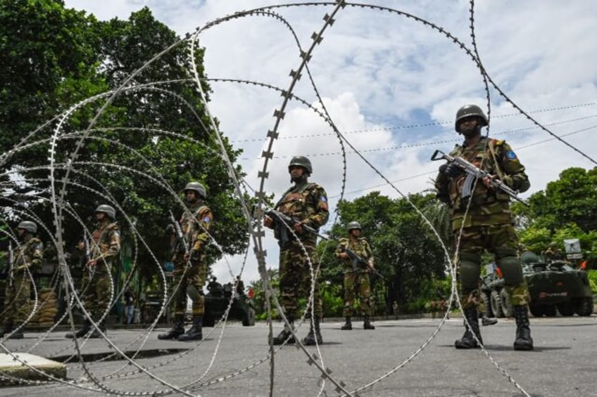 Bangladesh army personnel are manning checkpoints in the capital Dhaka, which is under cur