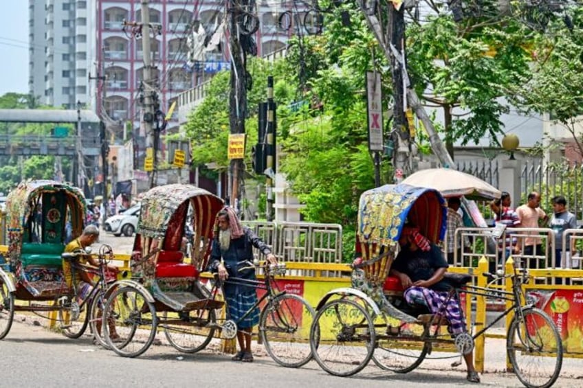 Rickshaw pullers rest from the heat in Dhaka -- the United Nations said this week Asia wa