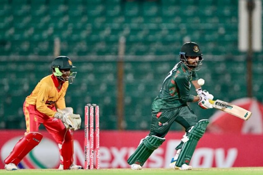 In the runs: Bangladesh's Towhid Hridoy plays a shot as Zimbabwe's wicketkeeper Joylord Gu