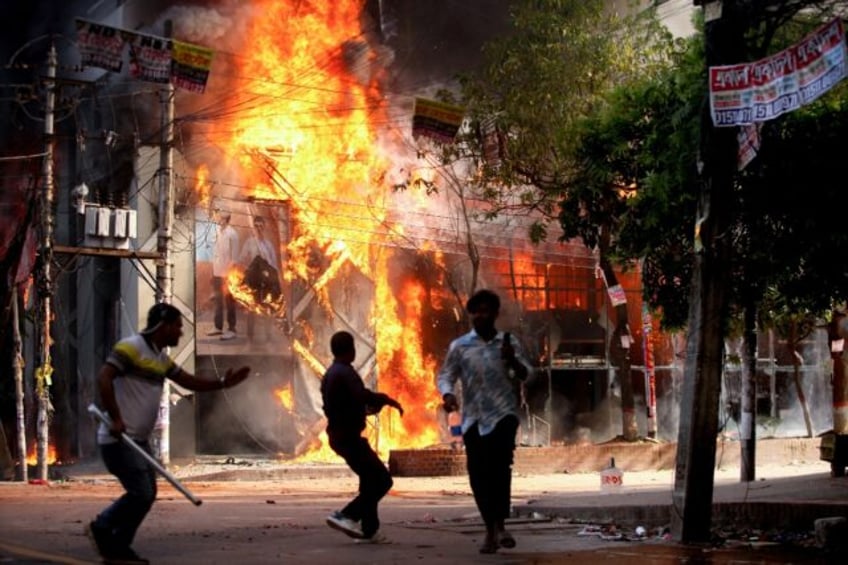 A garment store burns in the Bangladeshi capital Dhaka on August 4, after weeks of deadly