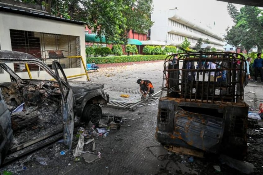 Charred vehicles are pictured at the state broadcaster Bangladesh Television, after studen