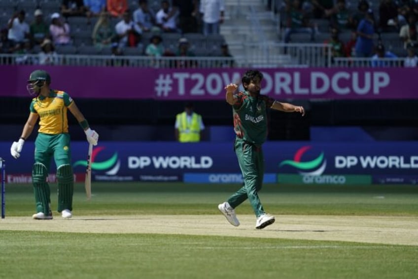 Man of the moment: Bangladesh fast bowler Tanzim Hasan Sakib on his way to three wickets i