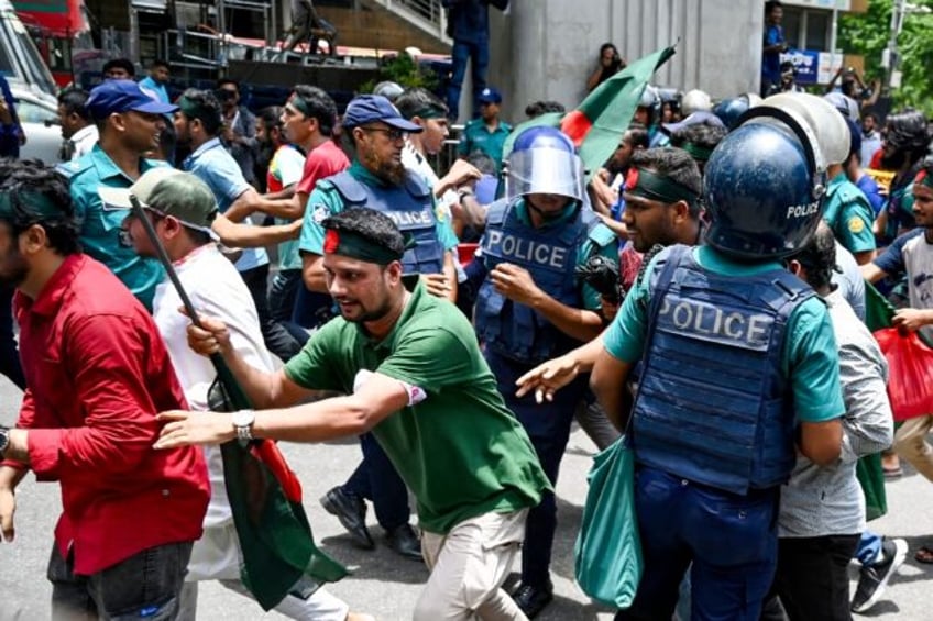 Student protesters block roads in in Dhaka as they demand a merit-based system for civil s