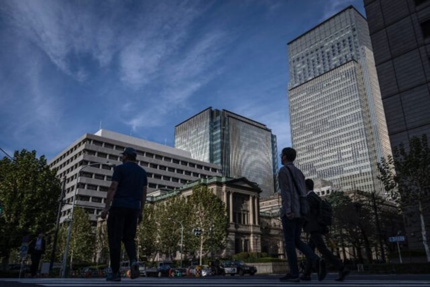 The Bank of Japan kept its main interest rate unchanged on Thursday, warning of 'high unce