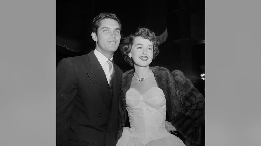 Barbara Rush and husband Jeffrey Hunter all dressed up and posing for photos