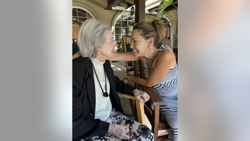 Barbara Rush and her daughter looking into each others eyes lovingly