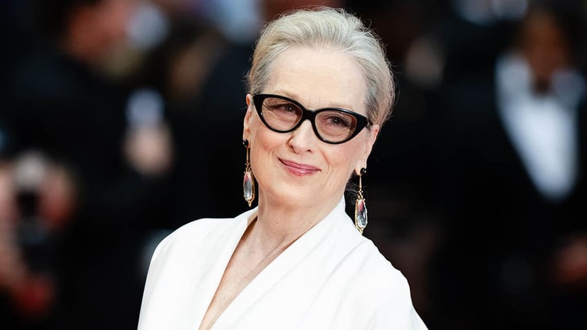 meryl streep looking to the side and smiling at cannes