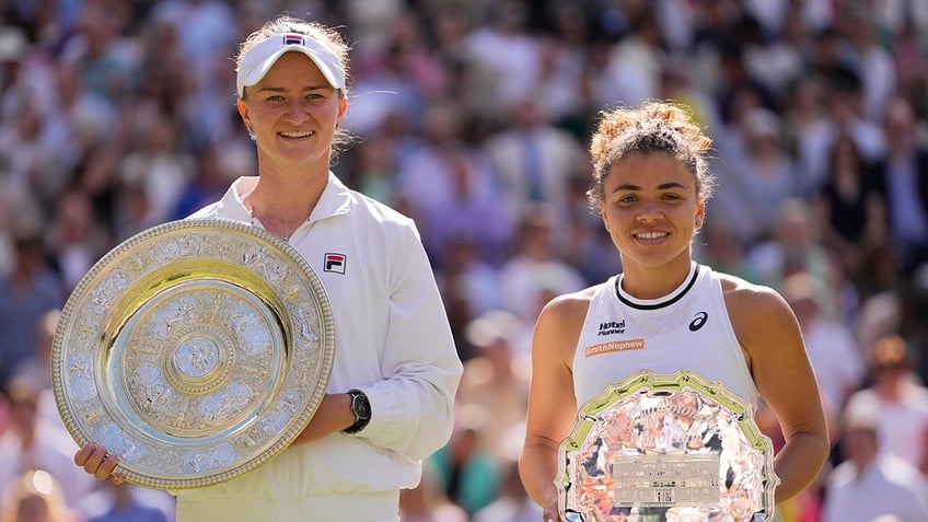 Barbora Krejcikova and Jasmine Paolini hold their trophies