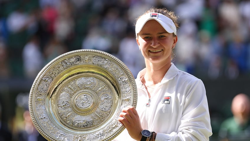 Barbora Krejcikova holds a trophy