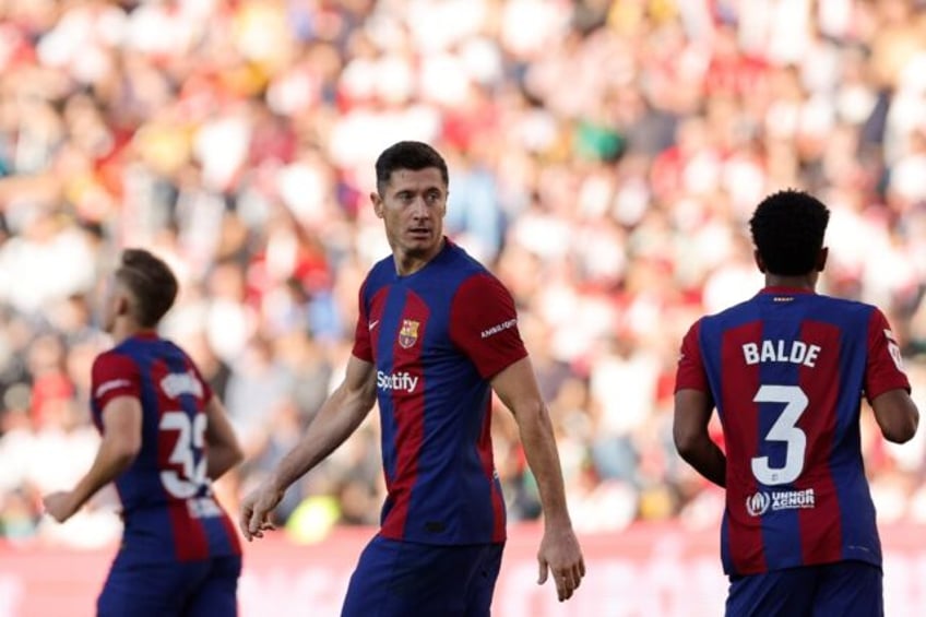 barca fall behind atletico after rayo draw