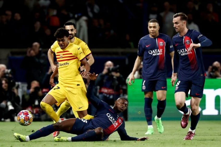 Lamine Yamal (L) became the youngest player ever to feature in the Champions League quarte