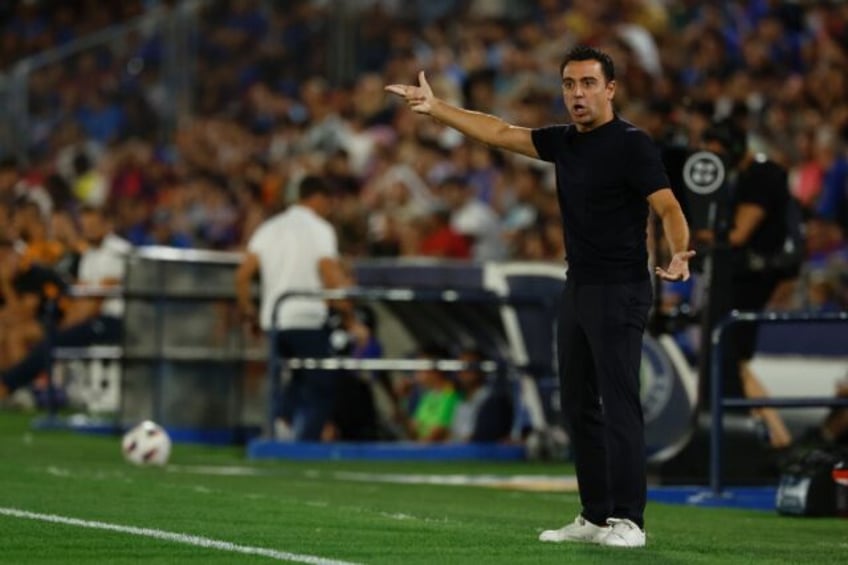 barca set up new home without suspended xavi