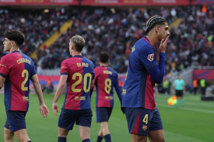 Barcelona's Uruguayan defender Ronald Araujo celebrates scoring his team's third goal agai
