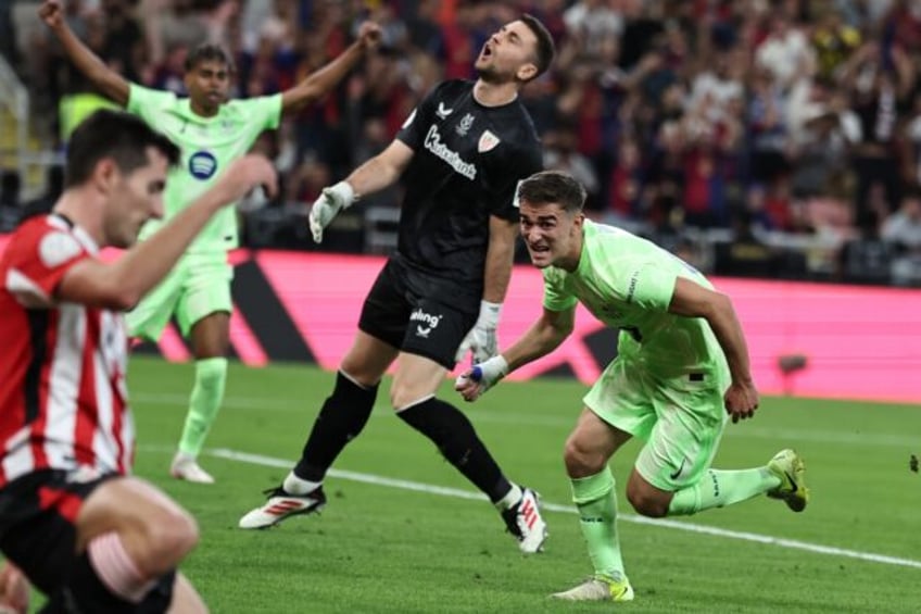 Barcelona's Spanish midfielder Gavi celebrates scoring his team's first goal against Athle