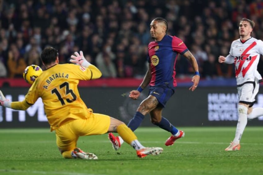 Barcelona's Brazilian forward Raphinha (C) and Co will look for revenge against Las Palmas