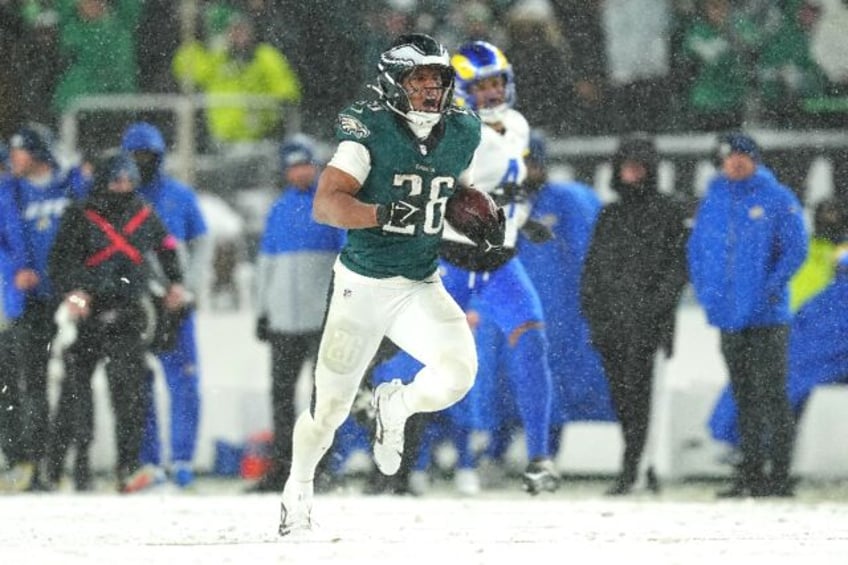 Philadelphia running back Saquon Barkley rushes through the snow for a 78-yard touchdown i