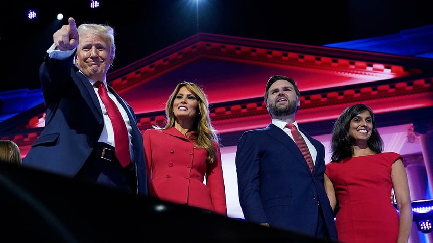 Republican presidential nominee and former President Donald Trump is joined on stage by wife Melania and Republican vice presidential nominee J.D. Vance and his wife Usha Chilukuri Vance, after he finished giving his acceptance speech