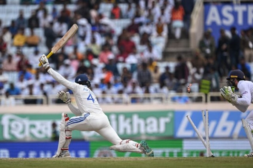 England's wicket-keeper Ben Foakes attempts to stump India's Akash Deep during the third d