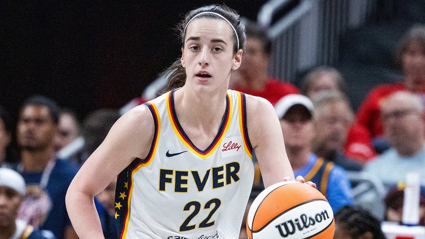 Caitlin Clark dribbles