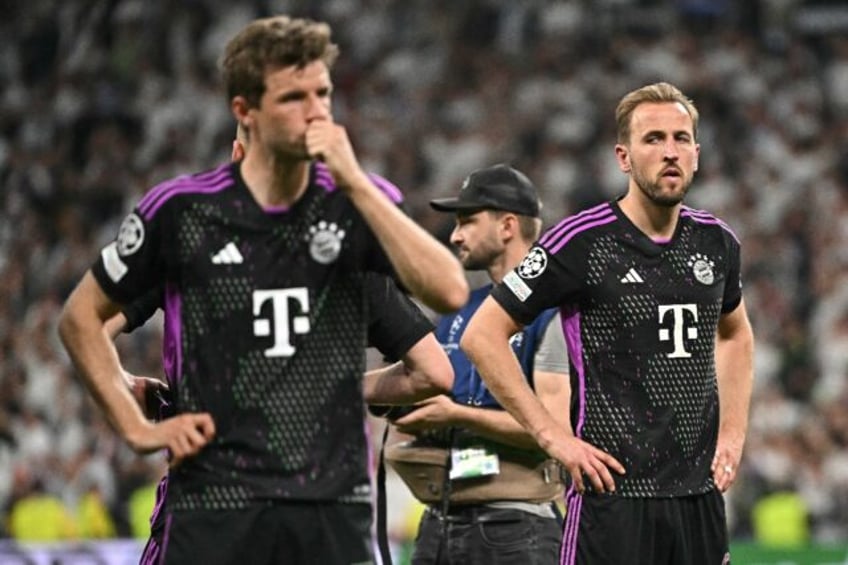 Bayern Munich forwards Thomas Mueller (L) and Harry Kane after their 2-1 loss to Real Madr
