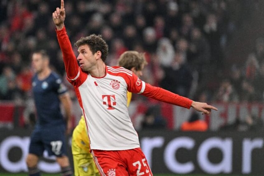 Bayern Munich forward Thomas Mueller points to the sky. He called upon the "football gods"