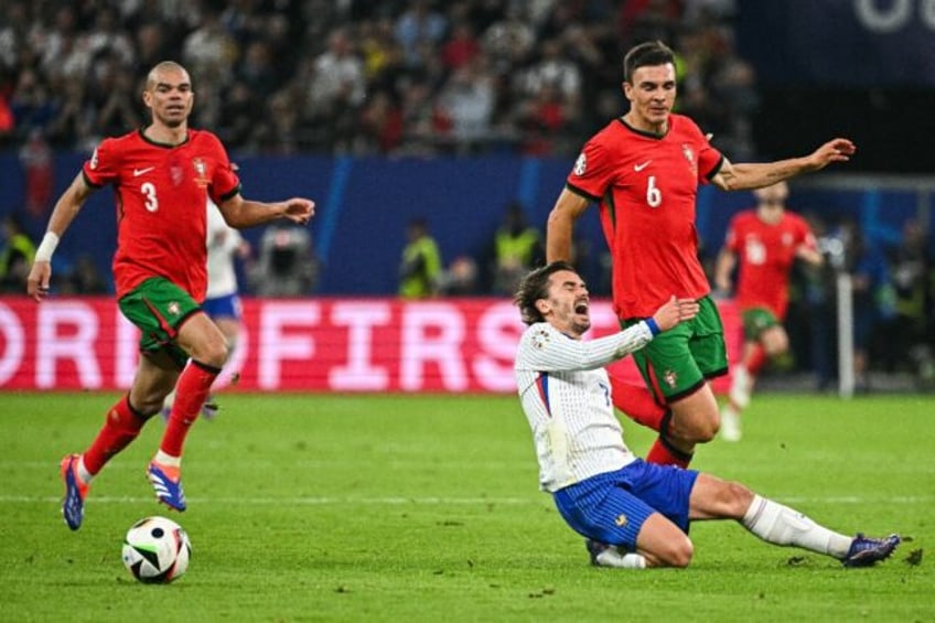 Portugal midfielder Joao Palhinha (R) signed for German giants Bayern Munich after a move