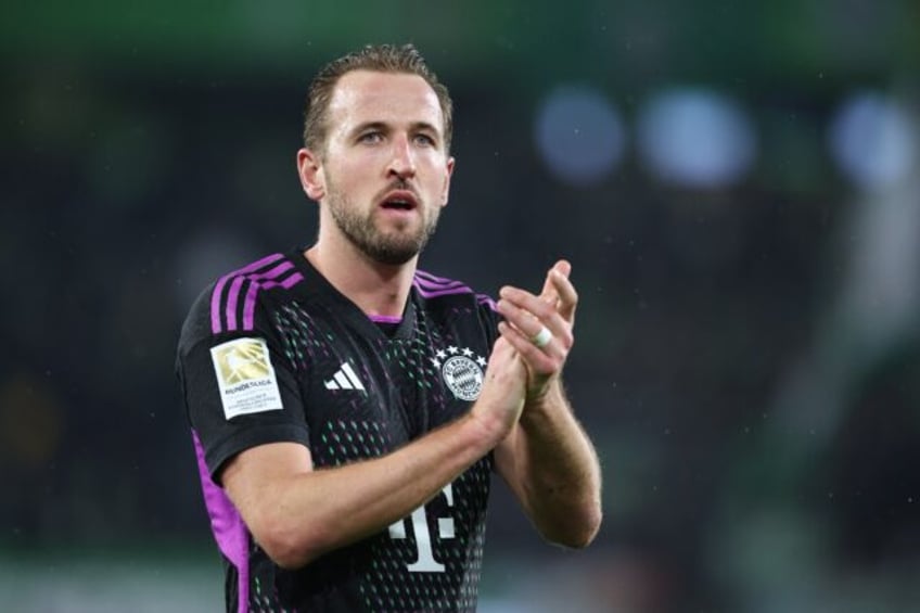 Bayern Munich forward Harry Kane applauds the fans after his side's 2-1 win away at Wolfsburg