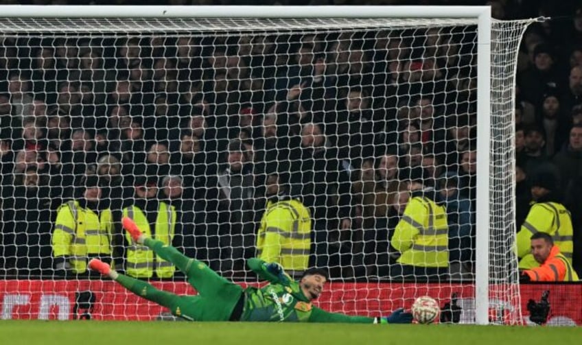 Man of the moment: Manchester United goalkeeper Altay Bayindir saves the penalty of Kai Ha