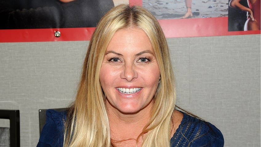 Nicole Eggert smiles in a photo