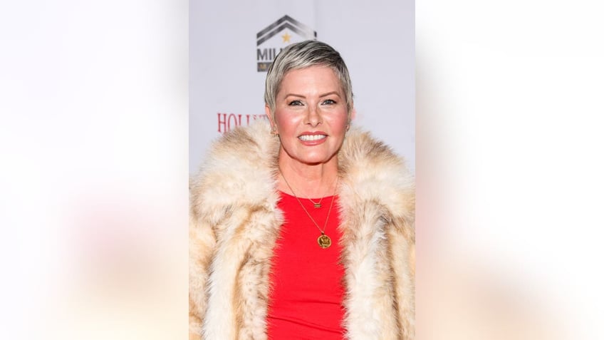 Nicole Eggert smiling at an event in Dec. 2024