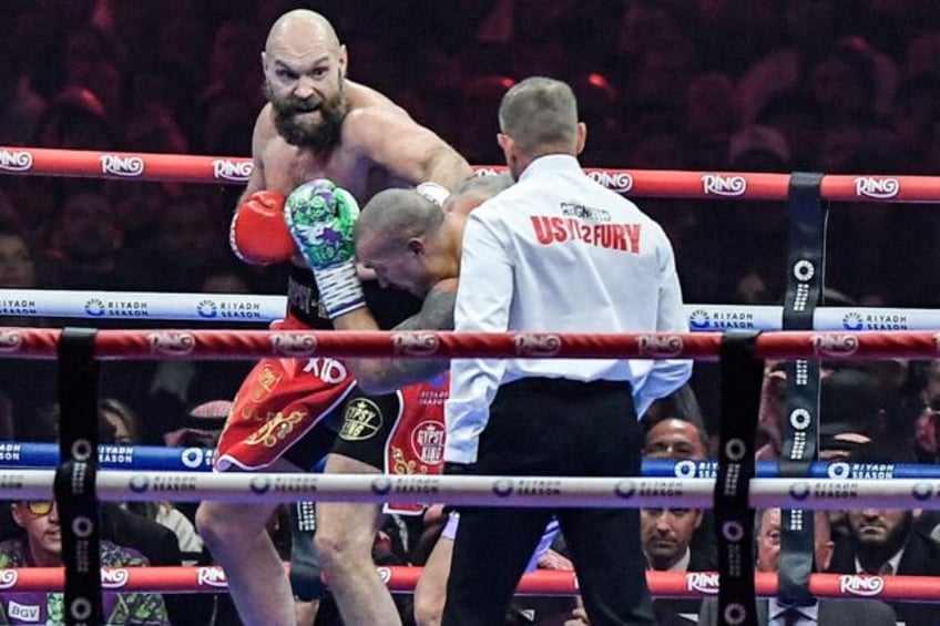 Britain's Tyson Fury (red) says Oleksandr Usyk's unanimous decision victory in their heavy