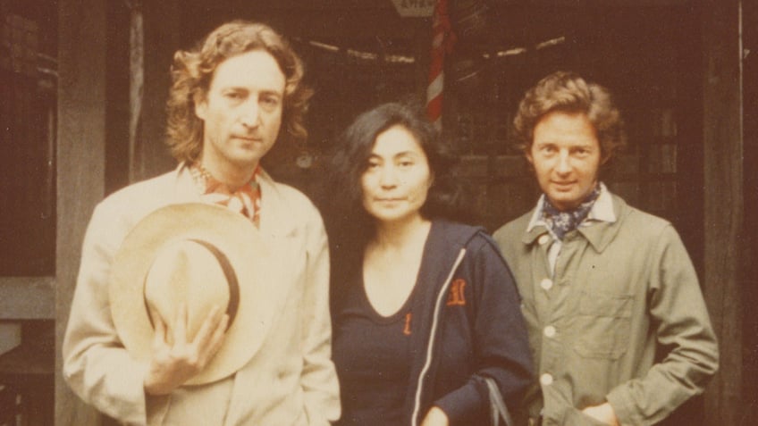 A close-up of John Lennon, Yoko Ono and Elliot Mintz