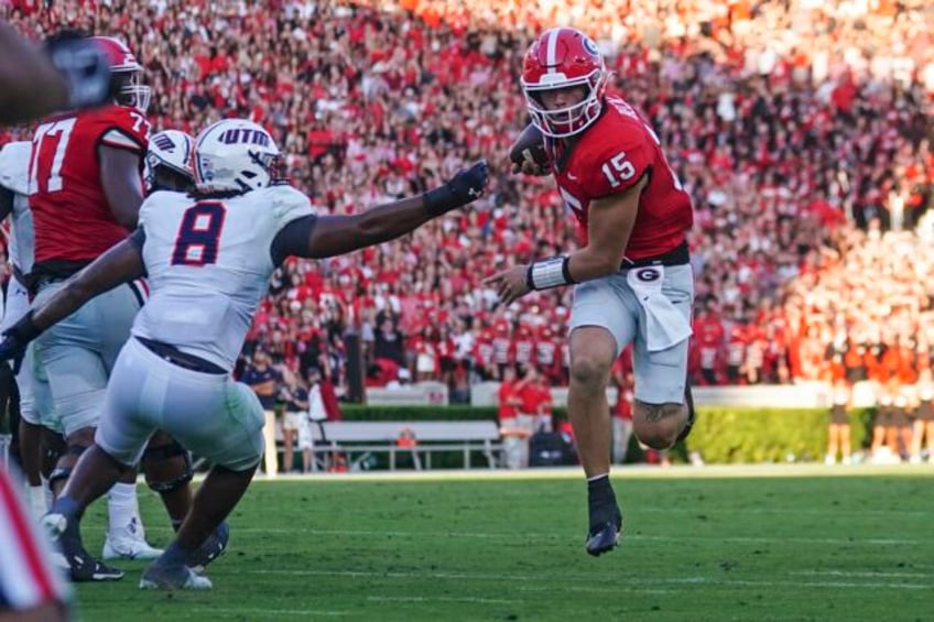 beck throws and runs for tds to launch new era as no 1 georgia rolls past ut martin 48 7