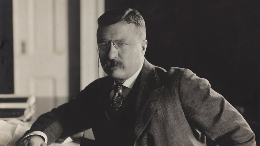 teddy roosevelt at his desk