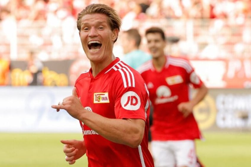 behrens hat trick fires stellar union past mainz