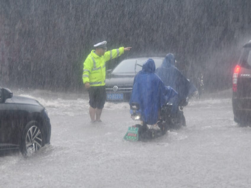 beijing deadly typhoon flooding forces tens of thousands of evacuations