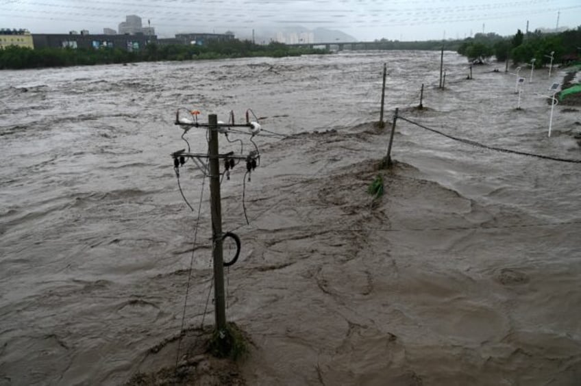 beijing on alert with two killed as heavy rain batters north china