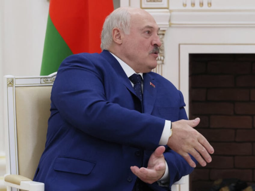 In this pool photograph distributed by the Russian state agency Sputnik, Belarus' Presiden