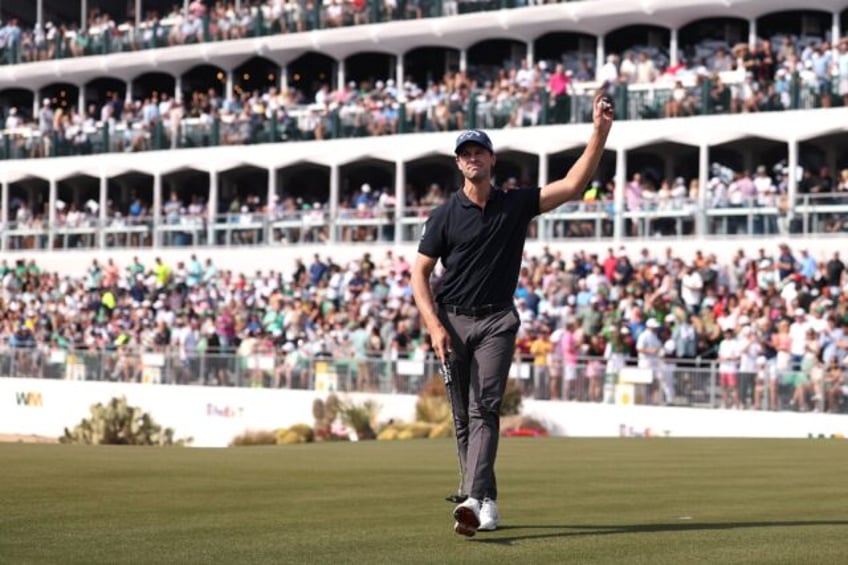 Belgian Thomas Detry acknowledges the crowd on the 16th green on the way to the second-rou