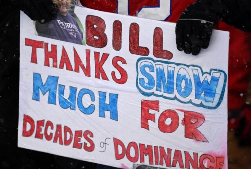 New England Patriots fans hold a sign "Bill, thanks snow much for decades of dominance" during the game against the New York Jets at Gillette Stadium on Sunday.