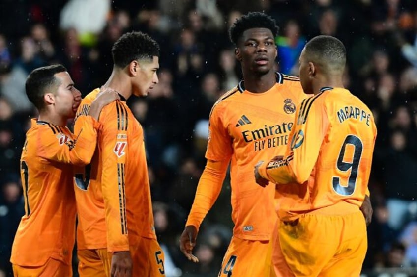 Real Madrid's English midfielder Jude Bellingham reacts after missing a penalty against Va