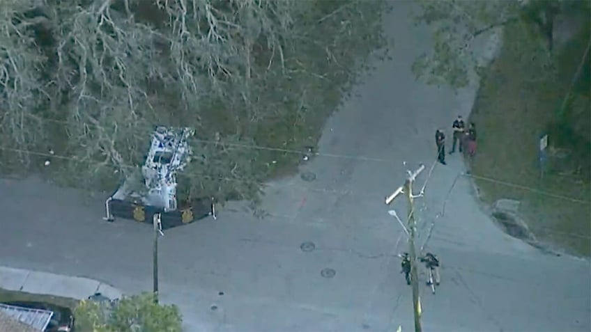 Aerial of USPS truck on side