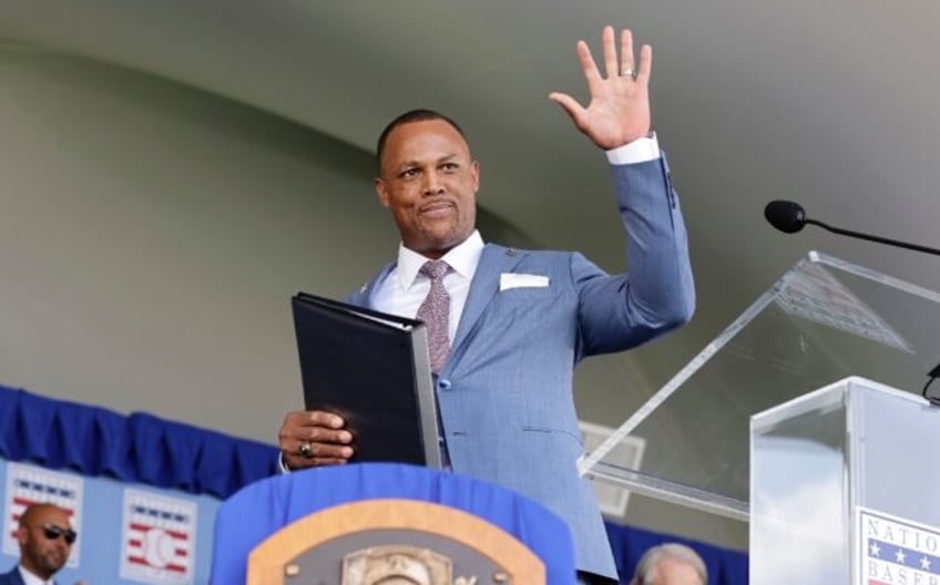 Dominican star Adrian Beltre waves to the crowd after being inducted into the Baseball Hal